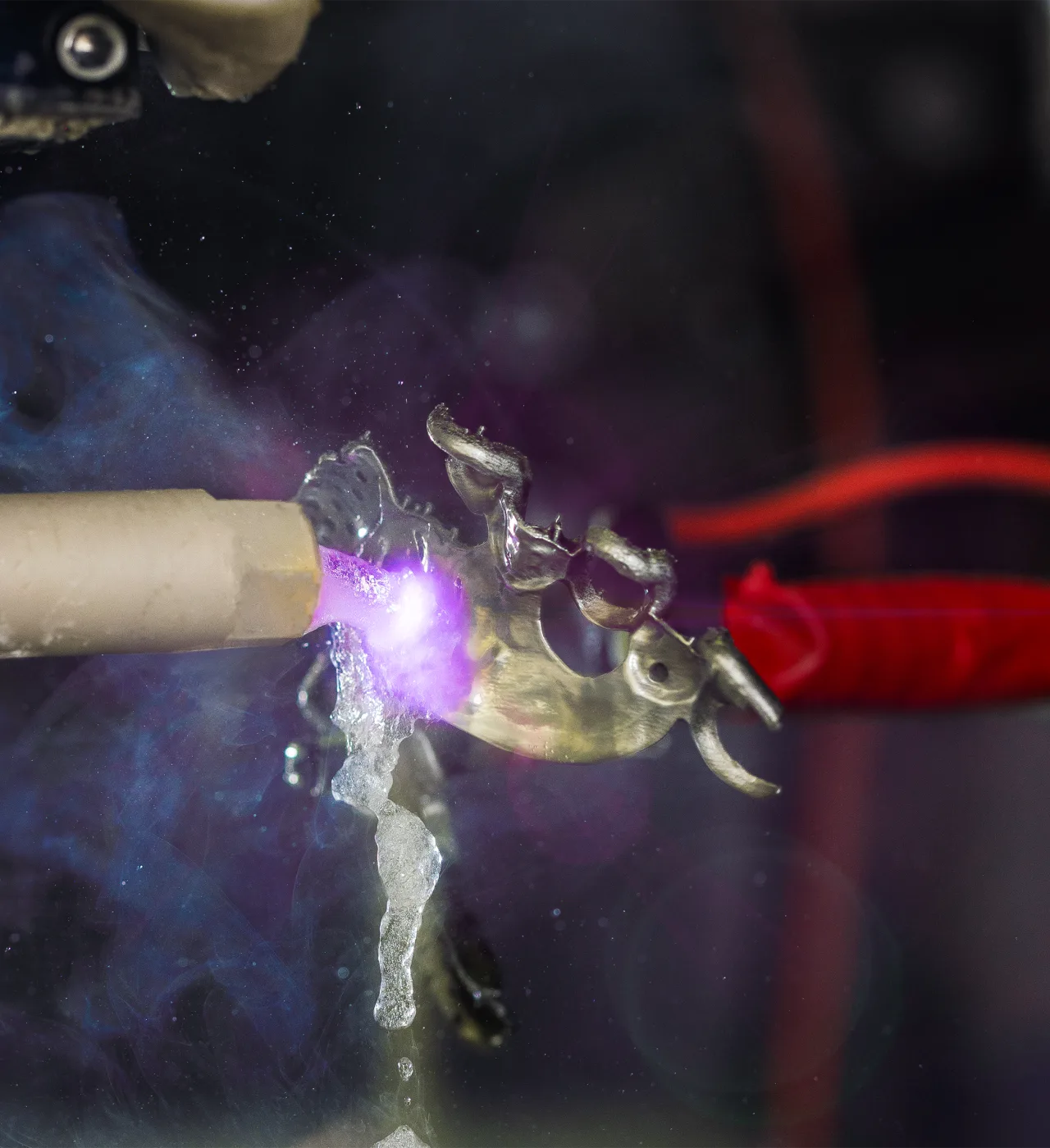A metal part being finished by the plasma polishing process